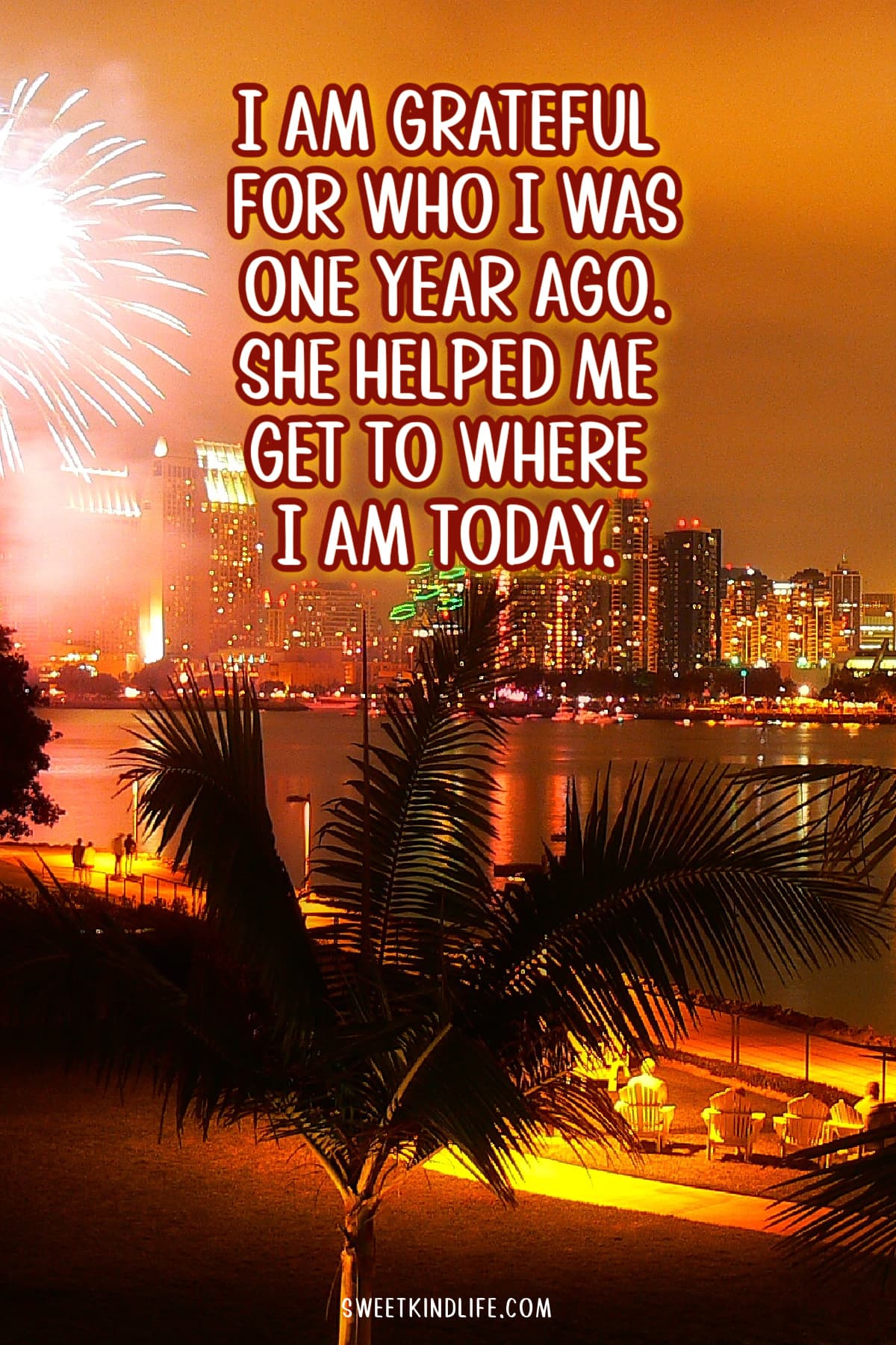 I am grateful for who I was one year ago. She helped me get to where I am today text overlay on a photo of fireworks and a lit city at night