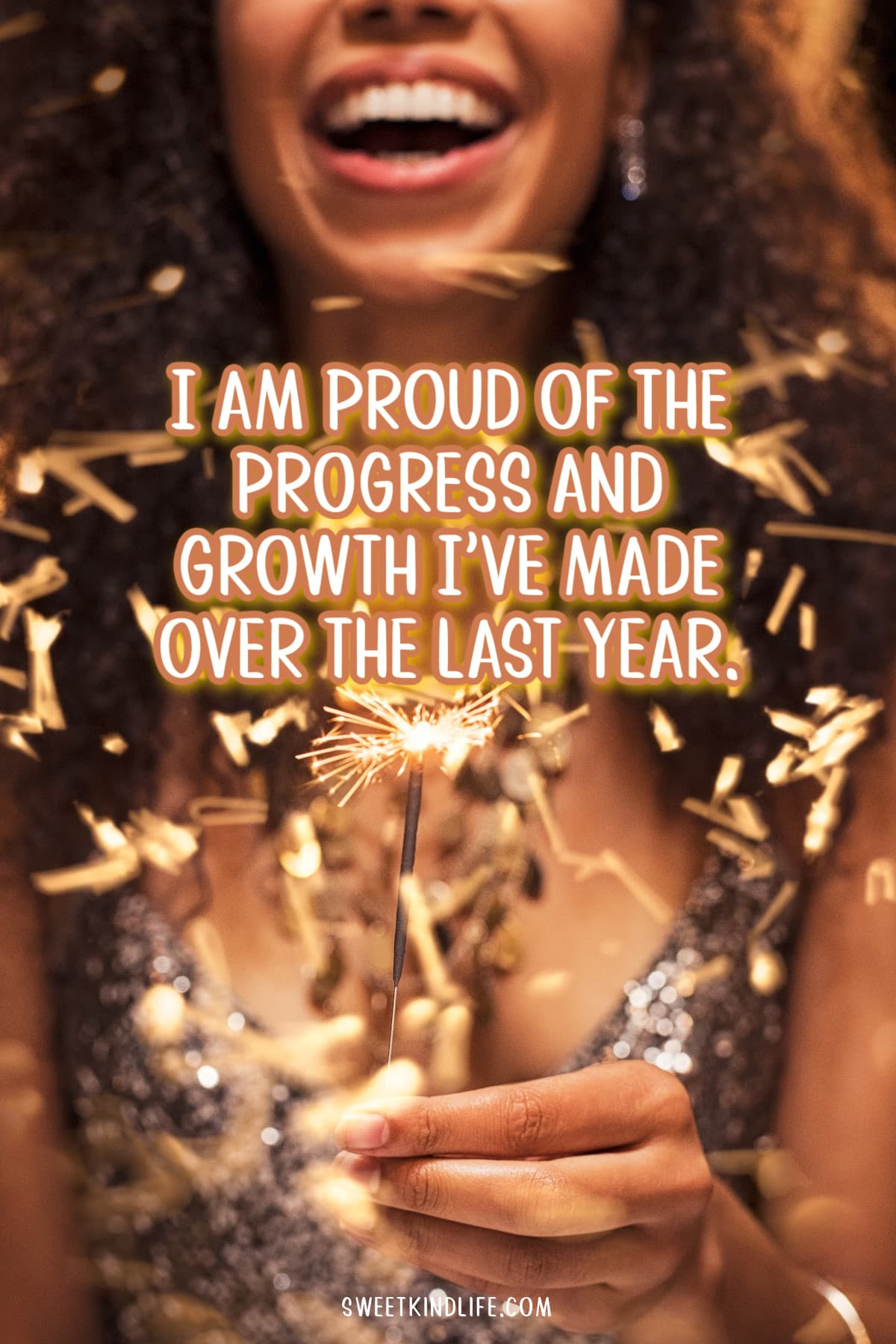 I am proud of the progress and growth I've made over the last year text overlay on a photo of a happy woman holding a sparkler