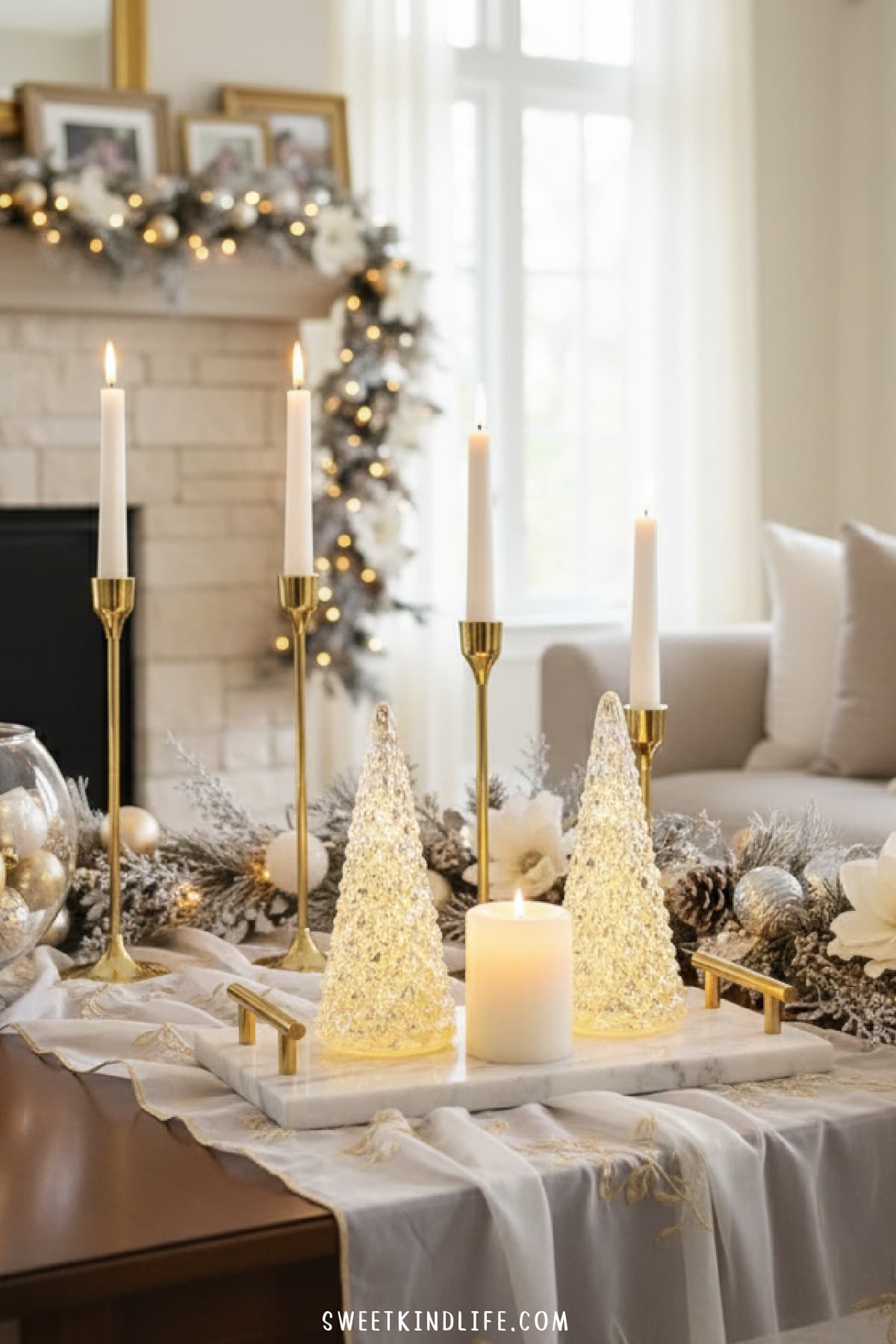 elegant coffee table christmas decor with tall candles, glass christmas trees, marble tray